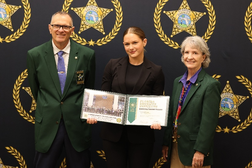 Crime Scene Investigations and Evidence Supervisor Savannah MacLellan, middle, graduates from the Florida Sheriffs Women’s Leadership Academy, Friday, March 6, 2026, in Orange Park, FL.