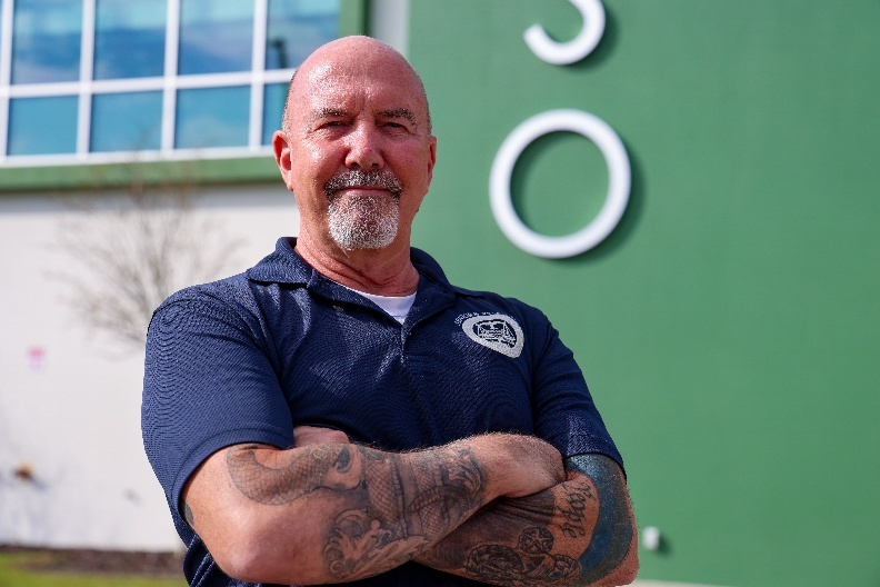 Mark Dyberg, a volunteer at the Flagler County Sheriff’s Office with Seniors vs. Crime, poses outside the Flagler County Sheriff’s Operations Center in Bunnell.