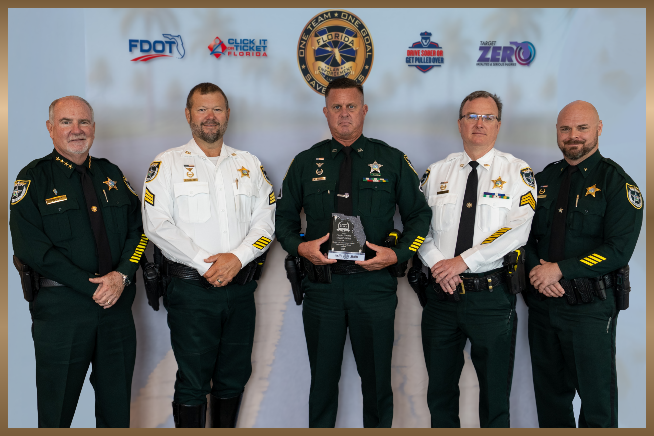 Sheriff Rick Staly, Sergeant Chris Ragazzo, Master Deputy Greg Nunziato, Sergeant Adam Biss, and Commander Jon Dopp pose with the 2026 Florida Law Enforcement Traffic Safety Challenge Award