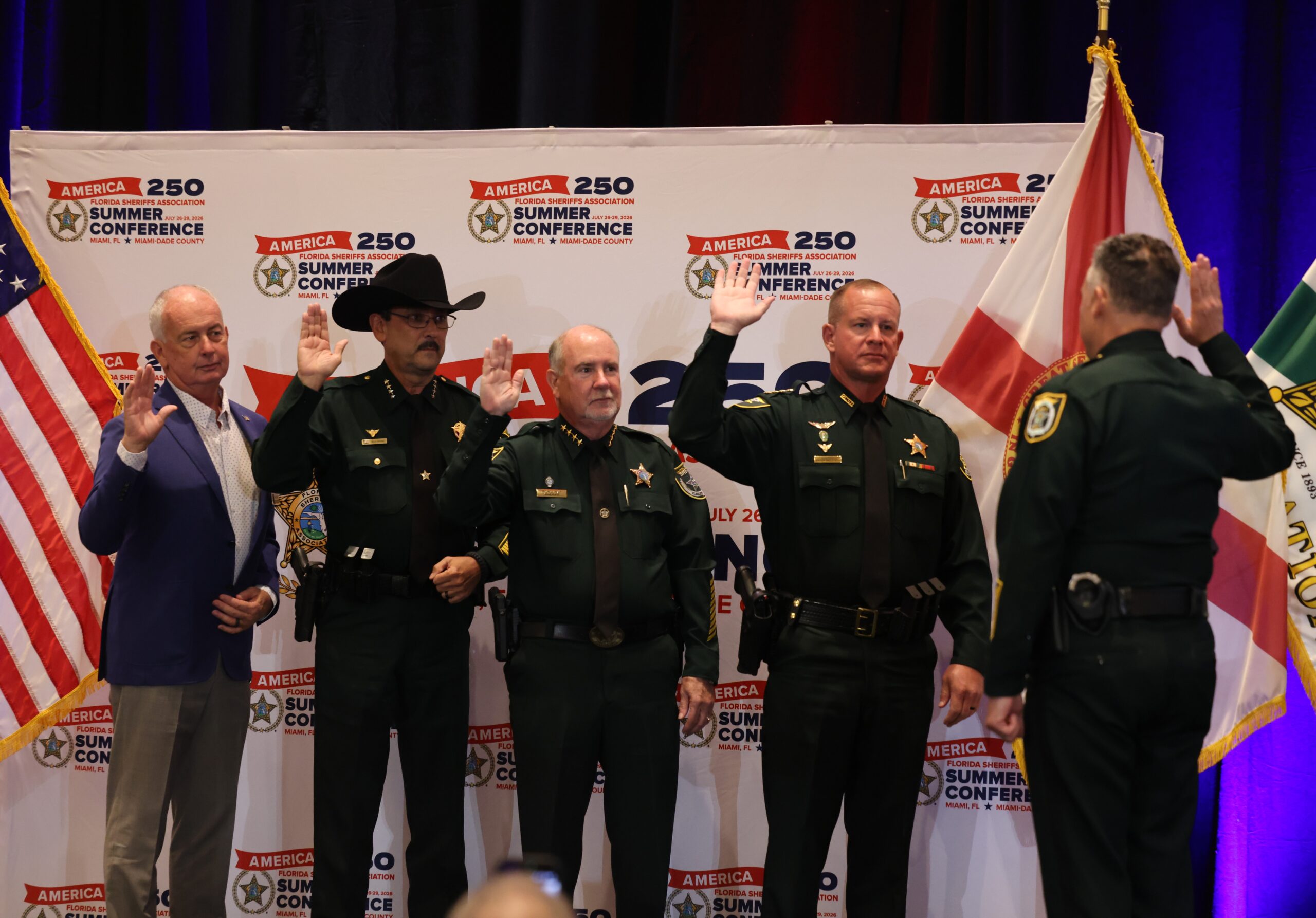 Flagler County Sheriff Rick Staly, middle, is sworn in as vice president of the Florida Sheriffs Association, alongside Franklin County Sheriff A.J. Smith as treasurer, Marion County Sheriff Billy Woods as president, and Putnam County Sheriff H.D. "Gator" Deloach III as secretary.